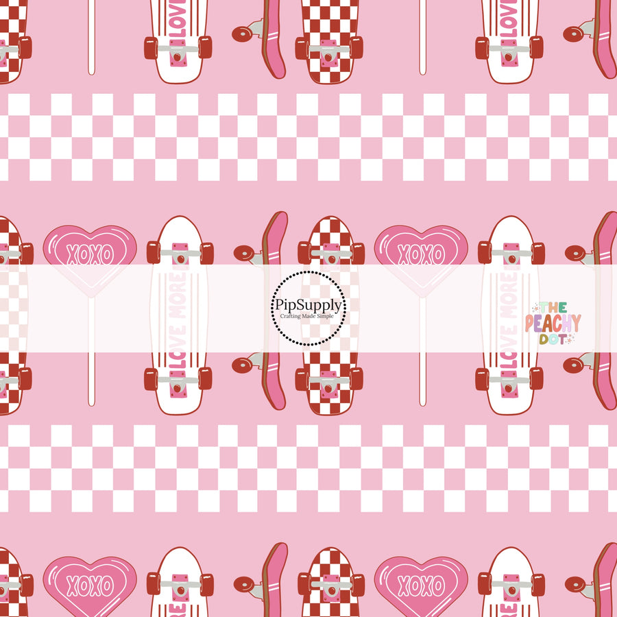 Pink fabric with pink heart lollipops with checkered skateboards