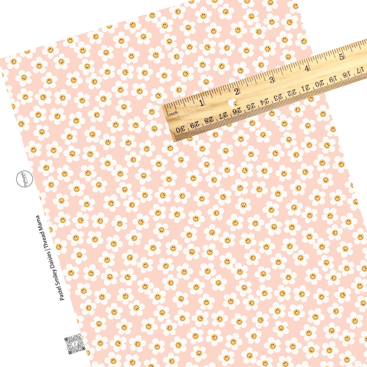 Orange center with a smiley face on a white daisy pink faux leather sheet