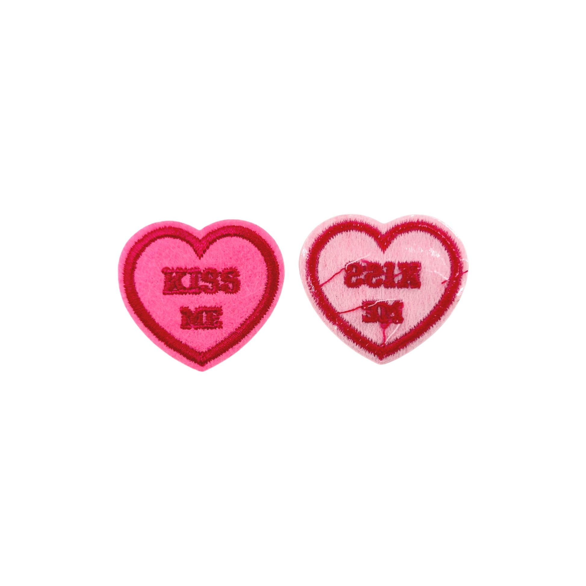 Heart shaped pink and red valentine's day chenille iron on patch with the words "Kiss Me" (front and back)