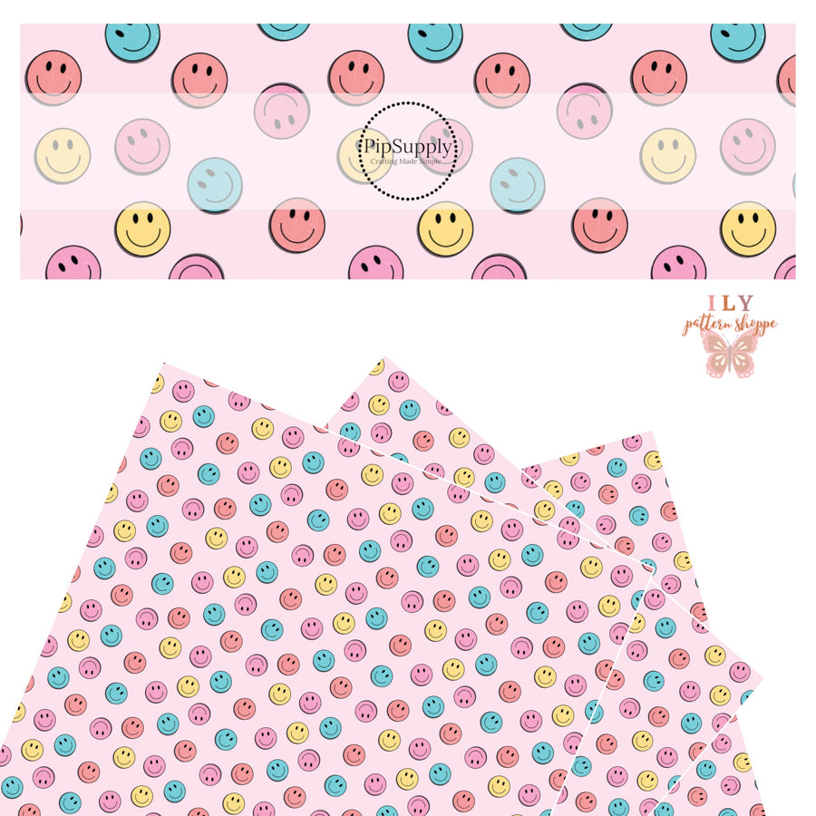 Coral, blue, pink, and yellow smiley faces on a light pink faux leather sheet