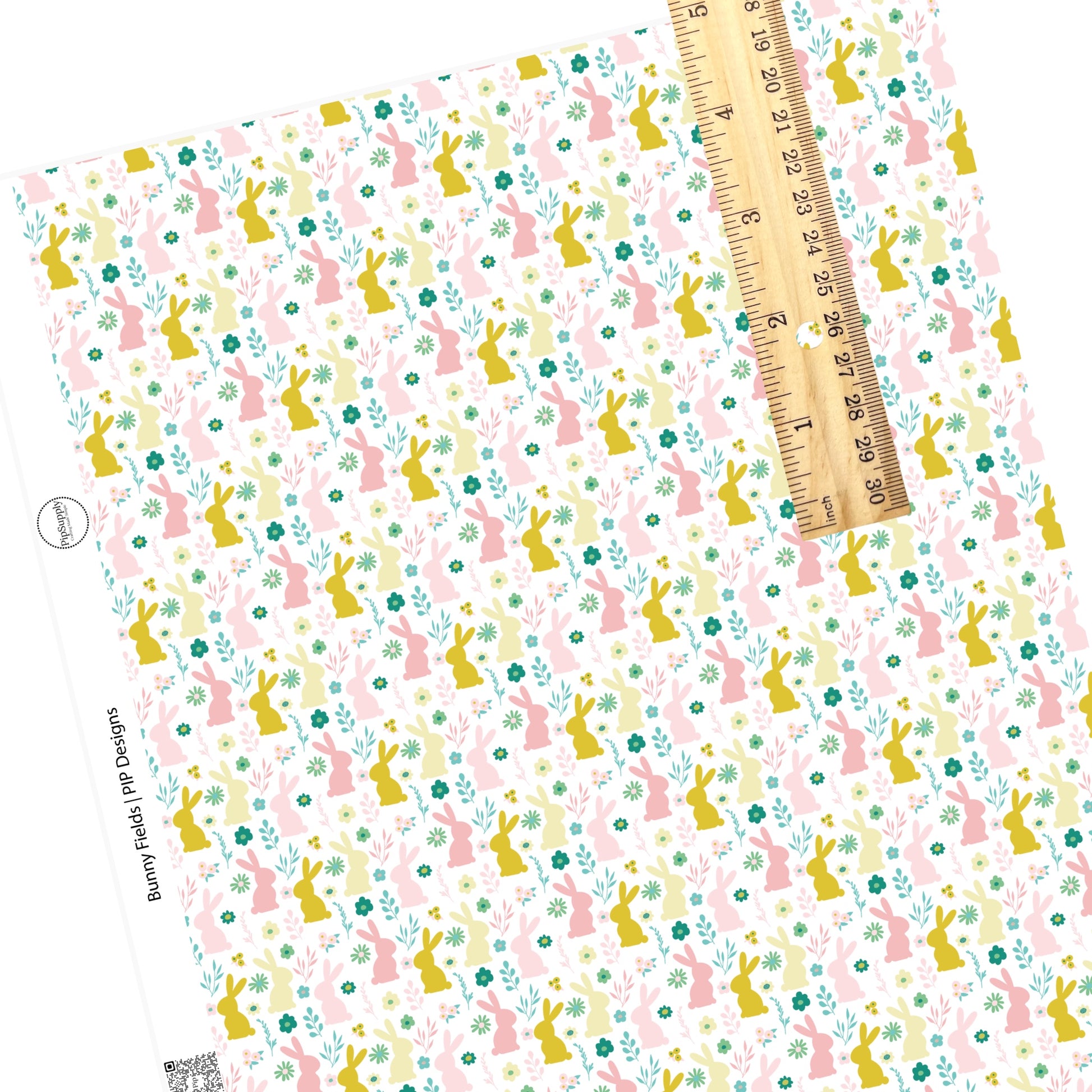 Pink, yelow, and green weeds and flowers with big pink and yellow bunnies on white faux leather sheet