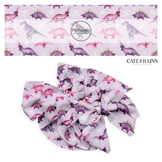 light purple bow strips with pink and purple dinosaurs and snowflakes