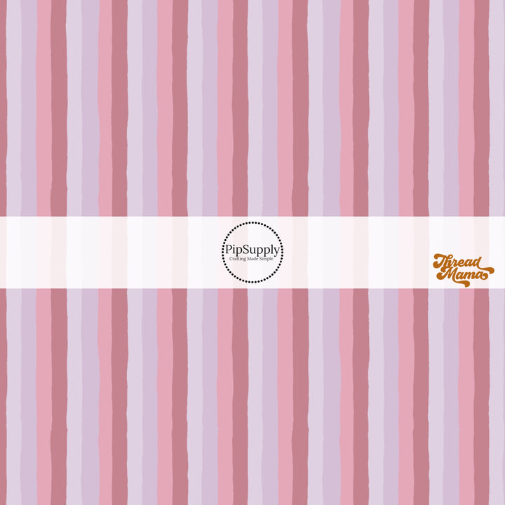 Muted pink and purple colored striped fabric by the yard pattern