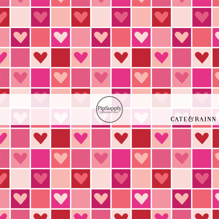 Hot pink, light pink, and red hearts checkered pattern fabric by the yard