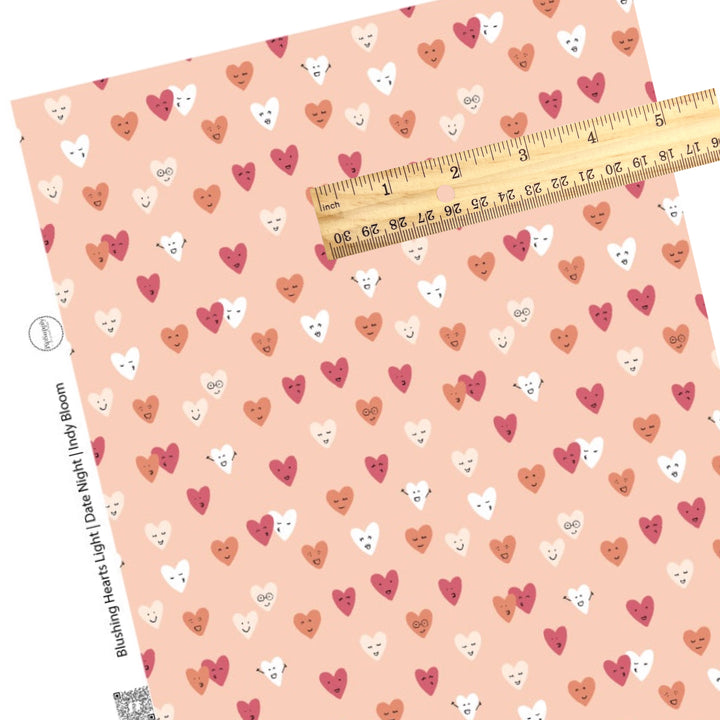 Happy heart faces on light pink faux leather sheet