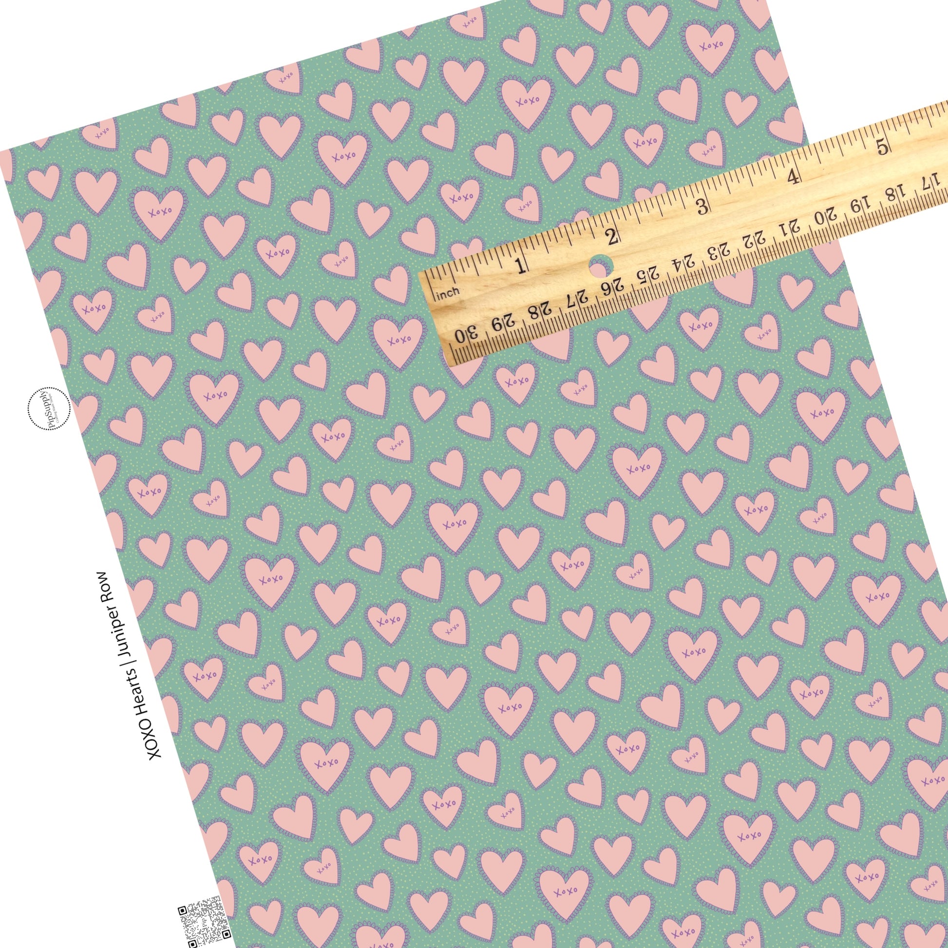 Seafoam faux leather with white polka dots and purple outlined pink hearts with XOXO words