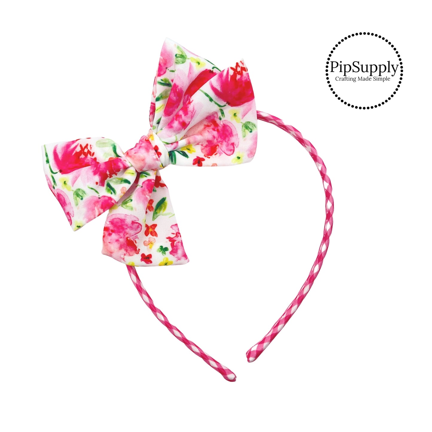 Pink flowers with tiny yellow and pink flowers with green stems on pink plaid bow headband