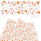 Gold fish snacks and pretzels with pink and blue hearts on cream faux leather sheets