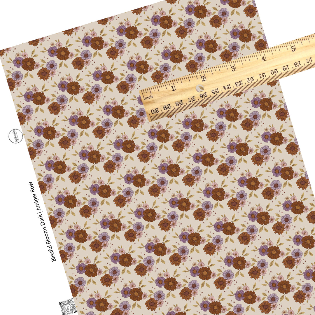 Tiny pink flowers, with big brown and purple flowers with brown stars on cream faux leather sheet