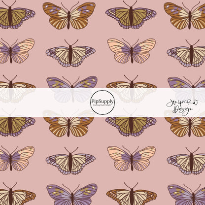 Pink, purple, brown, and cream multi butterflies on a mauve bow strip