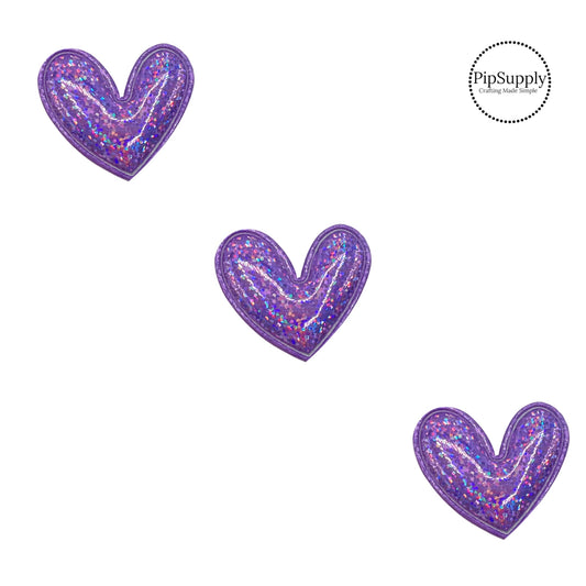 purple holographic padded heart craft embellishment measuring two inches with a fabric backing