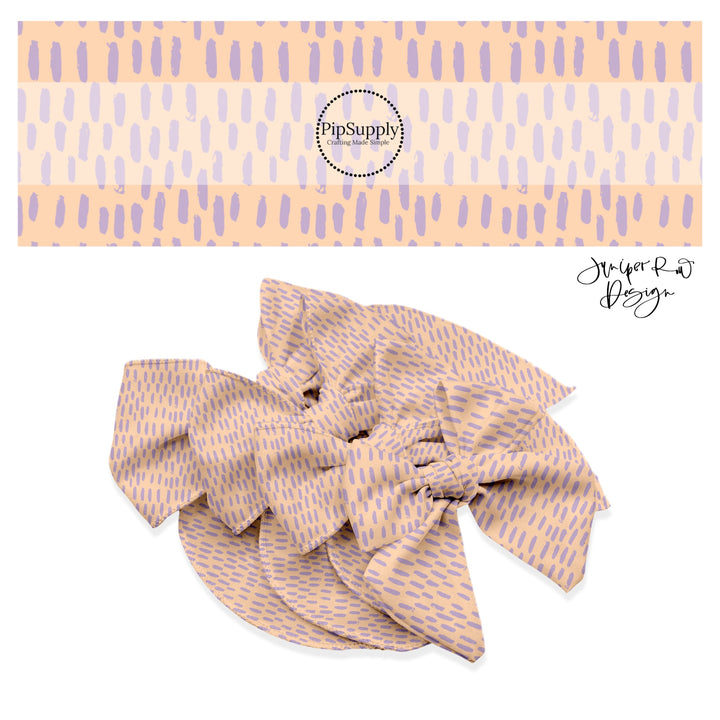 Scattered lavender dashes on light pink bow strips