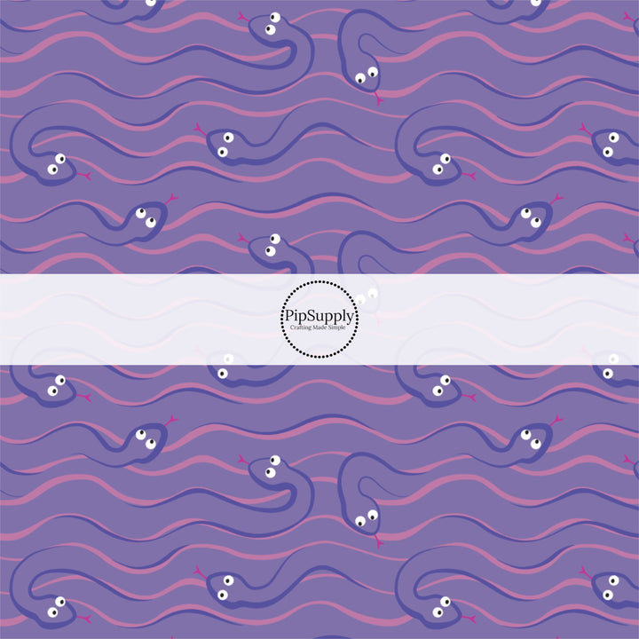 purple animated snakes on pink and purple fabric by the yard