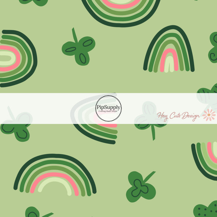 Dark green, green, light green, pink, and cream rainbows with multi design clovers on a green bow strip