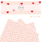 Drawn red hearts on cream faux leather sheet