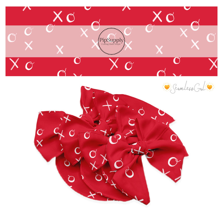 XO Cursive handwriting on a bright red bow strip