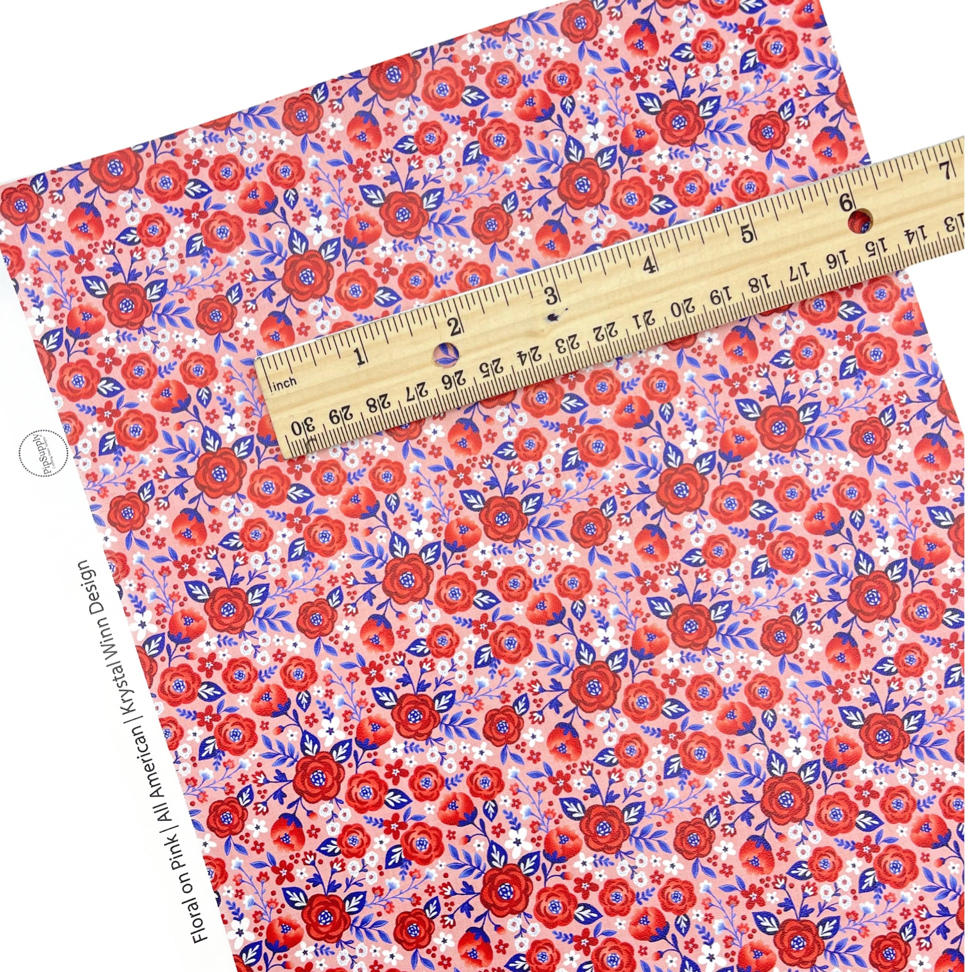 red white and blue floral faux leather sheet on pink background