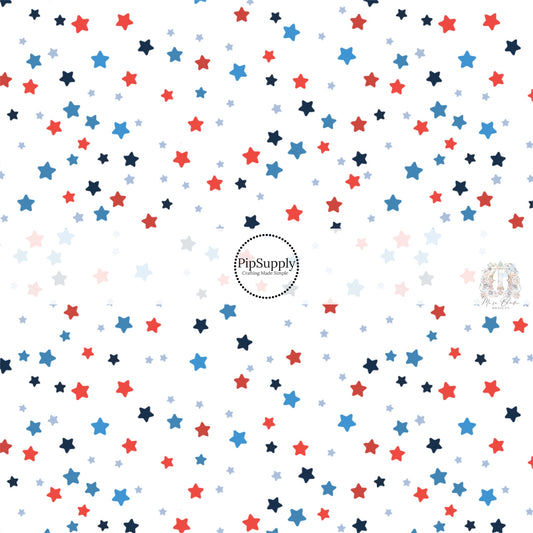 White fabric by the yard with red and blue stars.