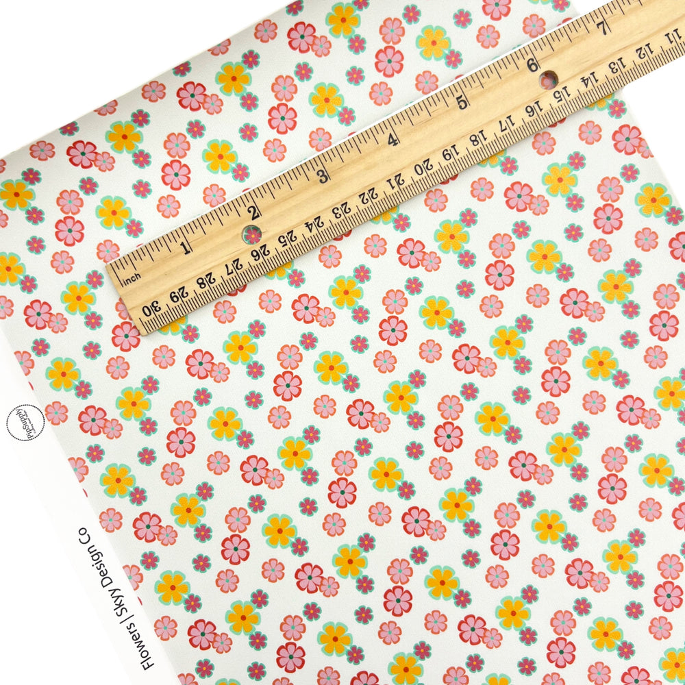 Yellow and Pink Daisies on white faux leather sheets