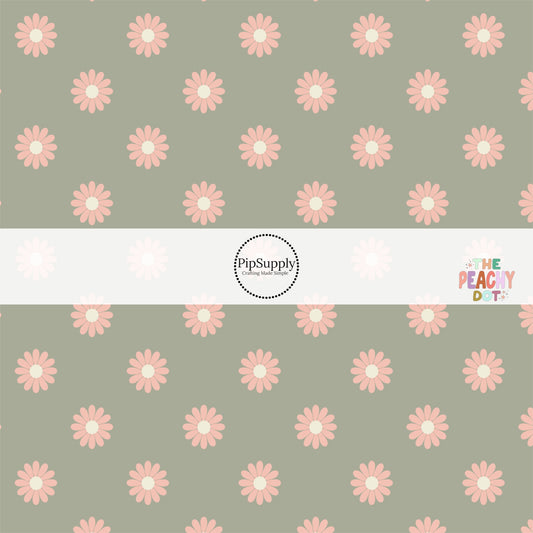 Sage green fabric by the yard with peach-colored daisies