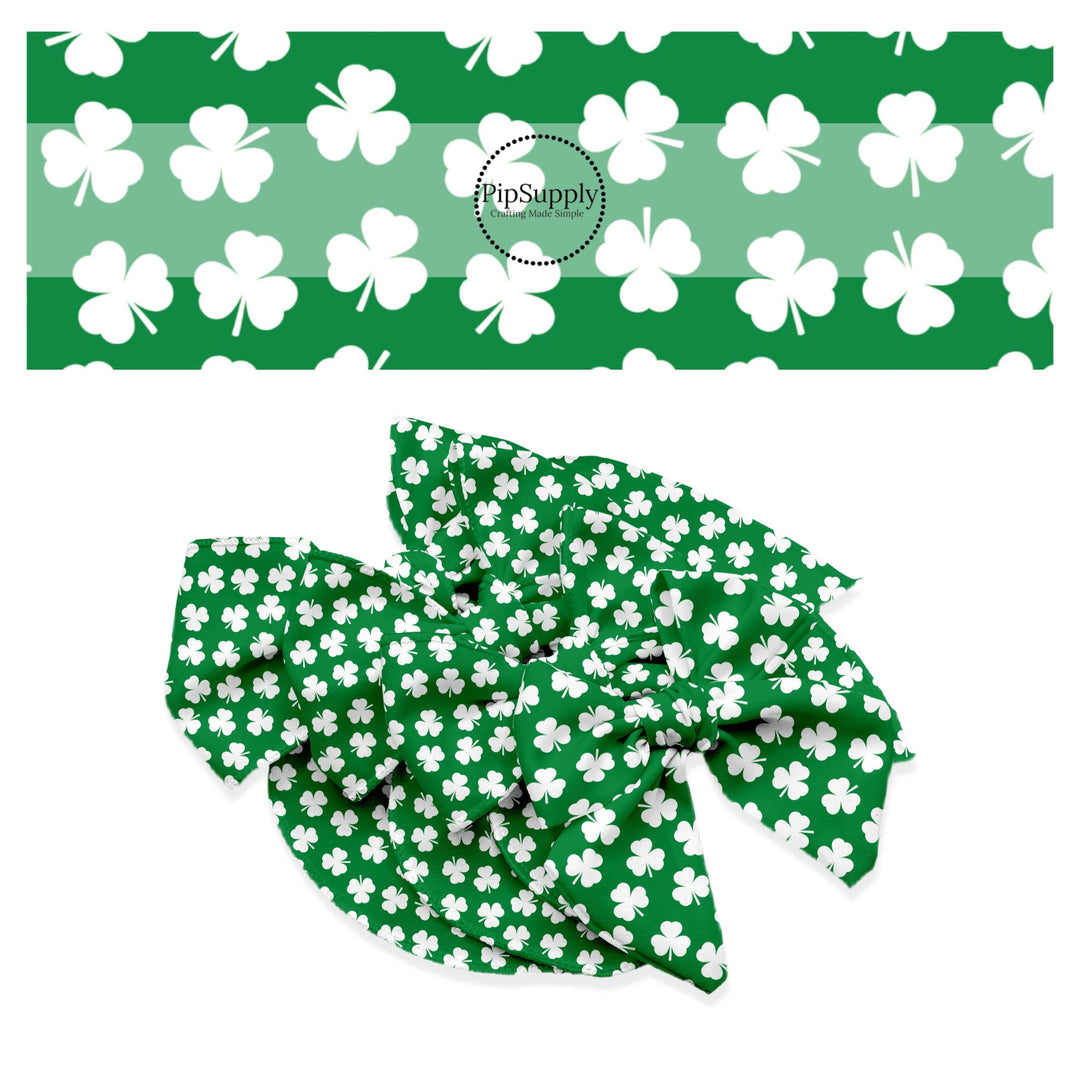 White shamrocks on a dark green bow strip