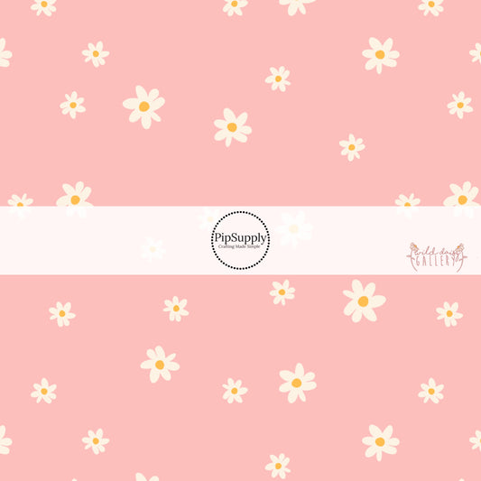 Light pink fabric by the yard with white scattered daisies