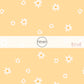 Pale yellow fabric by the yard with white scattered daisies 
