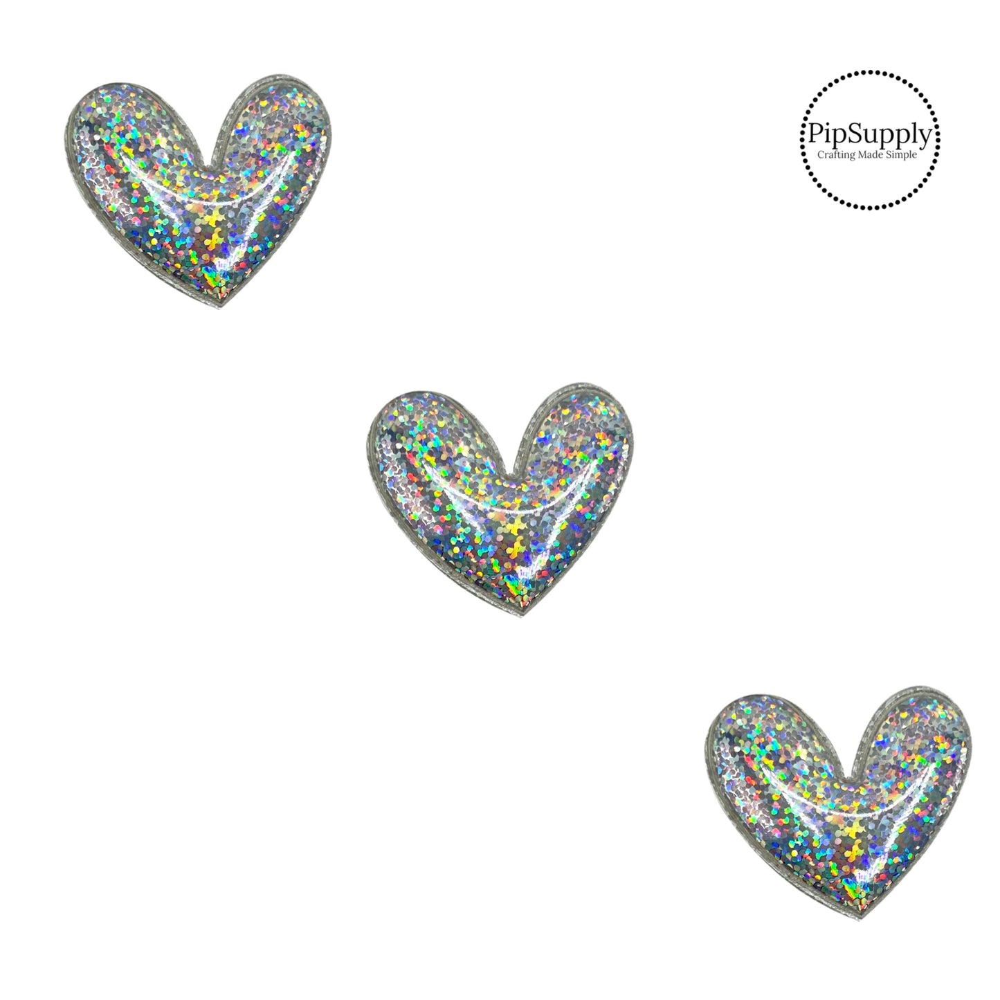 holographic heart craft embellishment with a fabric backing and is about 2 inches wide