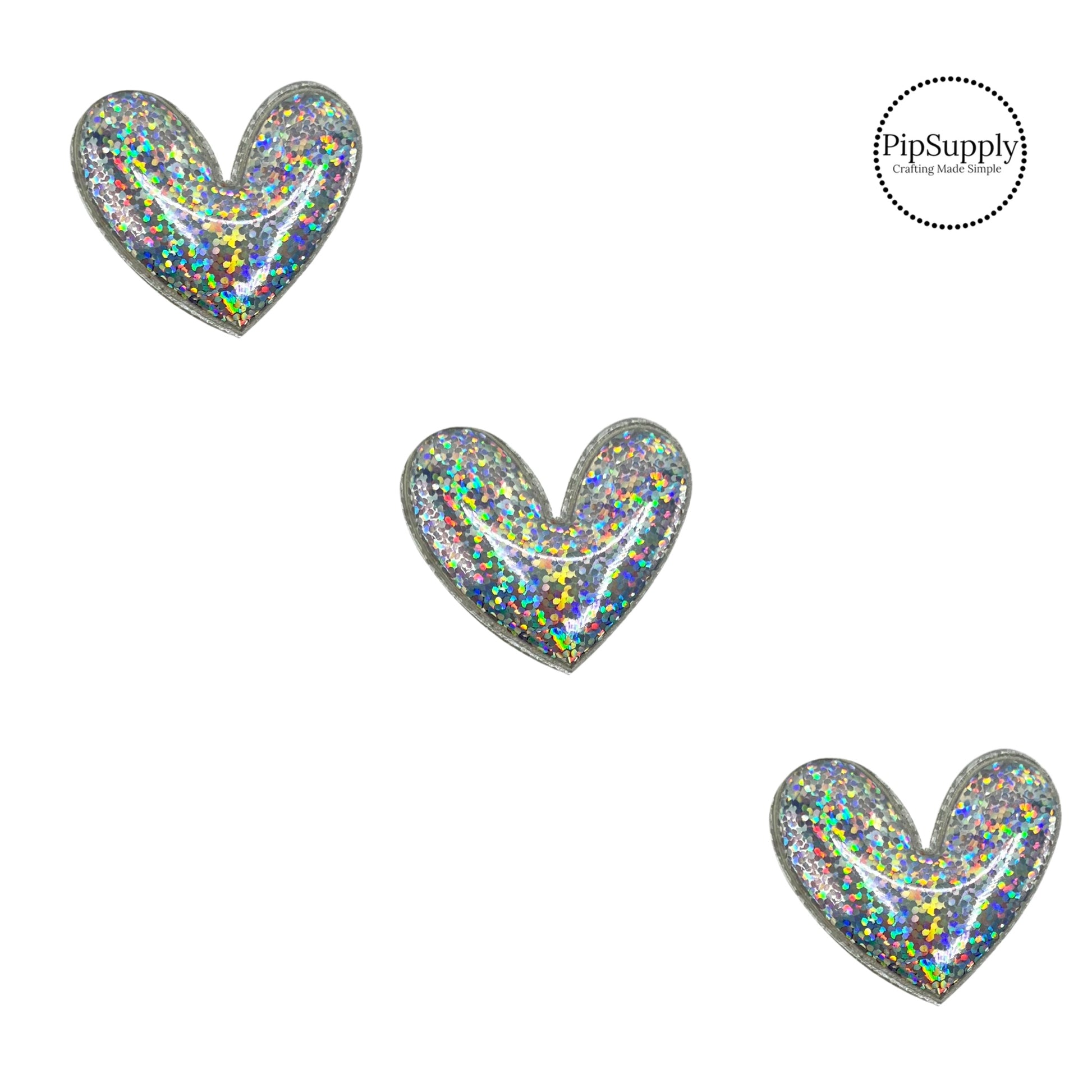 holographic heart craft embellishment with a fabric backing and is about 2 inches wide
