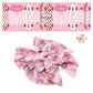 Vertical checkered skateboards on pink bow strips