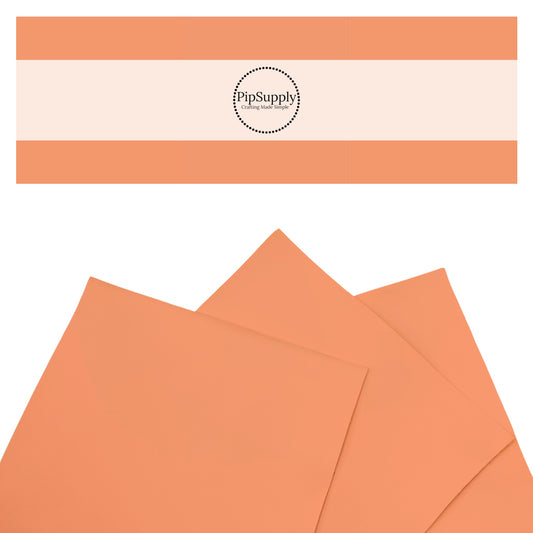 Smooth tangerine orange solid faux leather sheets.