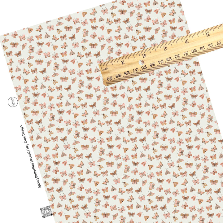 Neutral butterflies and dot style pattern faux leather sheet.