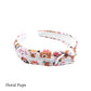 White fabric knotted headband with spring floral crown dogs pattern designed by Hey Cute Deisgn.