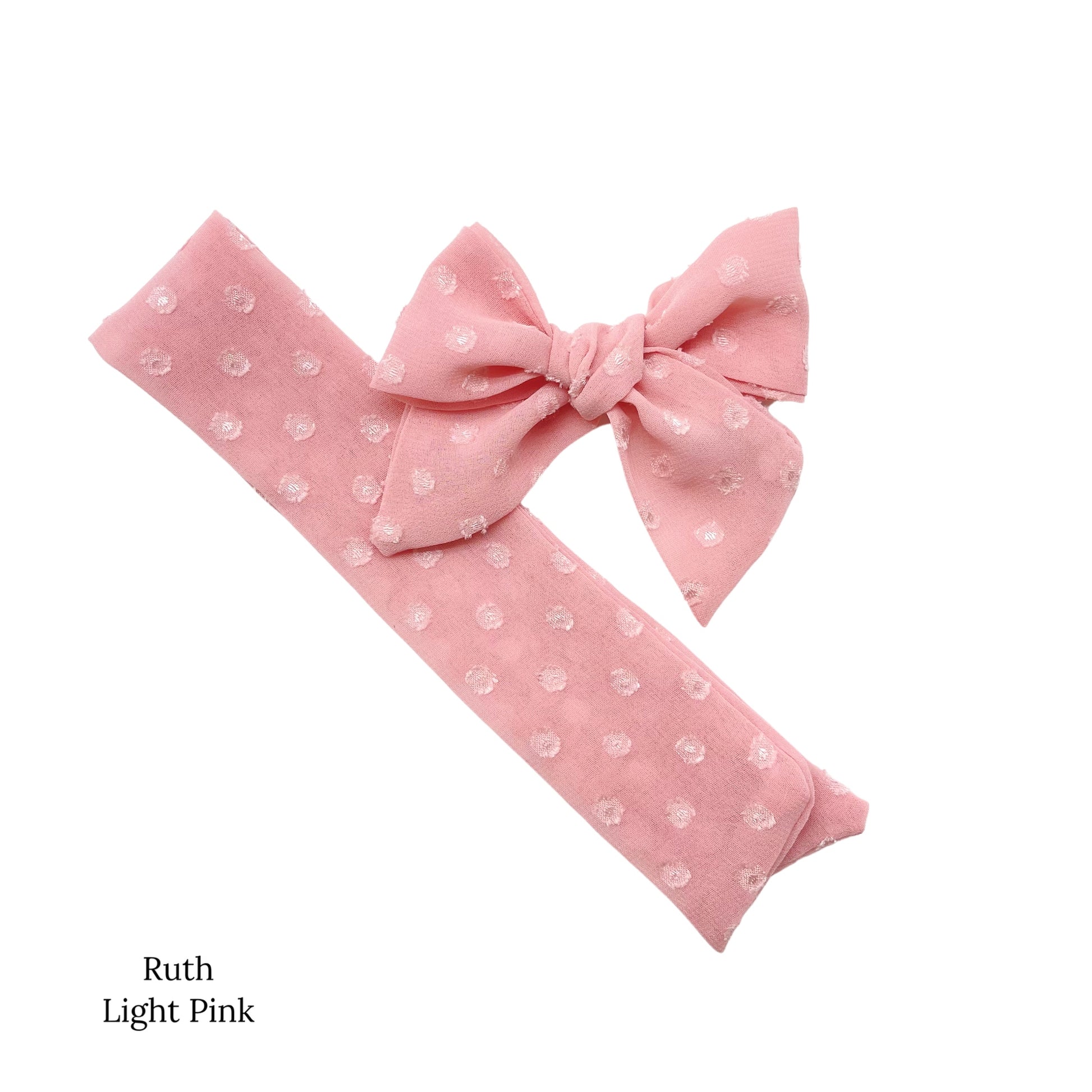 Spring frayed dot fabric bow strips. Light pink colored sailor style bow strip.