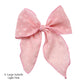 Spring frayed dot fabric bow strips. Light pink colored X-large serger bow strip.
