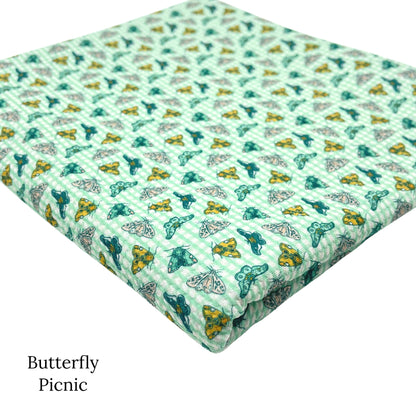 Spring meadow pattern liverpool bullet fabrics. Butterfly picnic print liverpool bullet fabric.