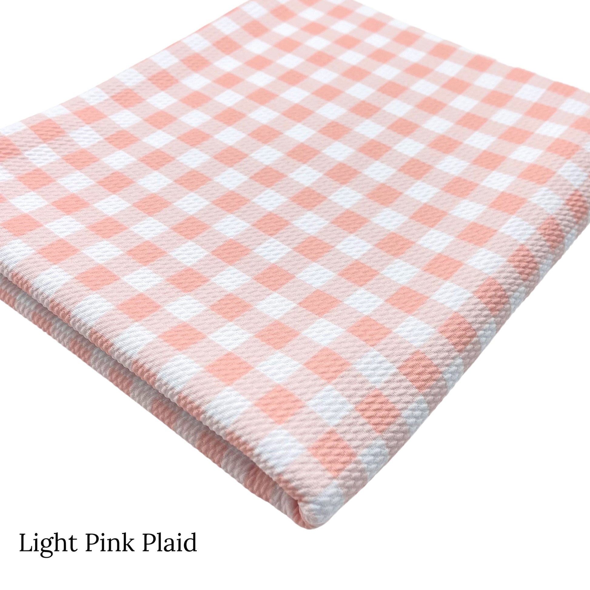 Spring meadow pattern liverpool bullet fabrics. Light pink plaid print liverpool bullet fabric.