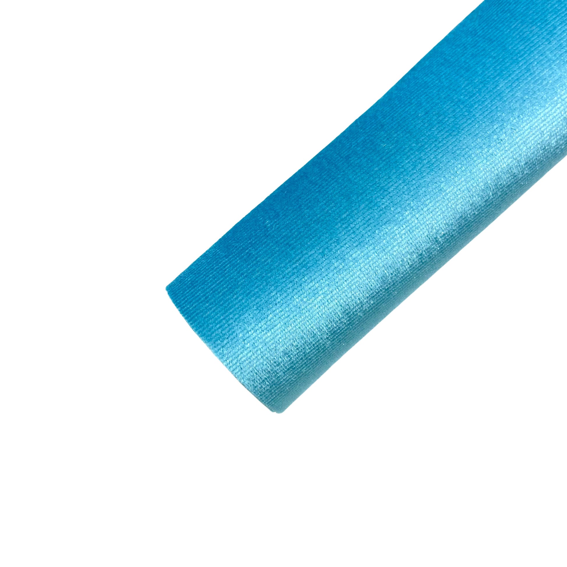 Rolled solid colored velvet sheet in bright ocean blue.