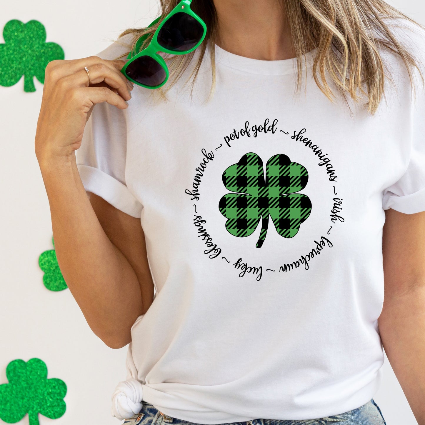 Green and black buffalo plaid clover with a black outline that says "Pot of gold"