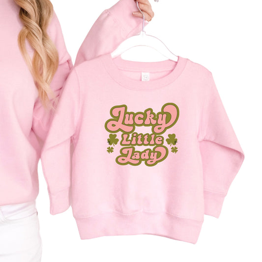Pink Iron on heat transfer that says "Lucky Little Lady" with a green outline and shamrocks