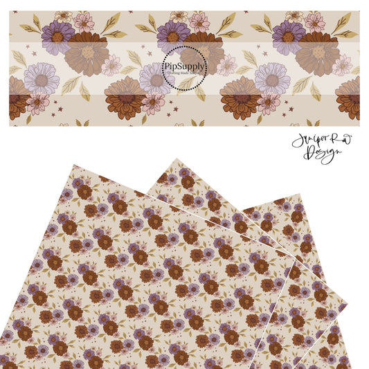 Brown, purple, and pink flowers with brown center with green leaves and brown stars on dark cream faux leather sheet