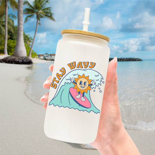 Sun surfing a wave with the phrase Stay Wavy adhesive decal sticker