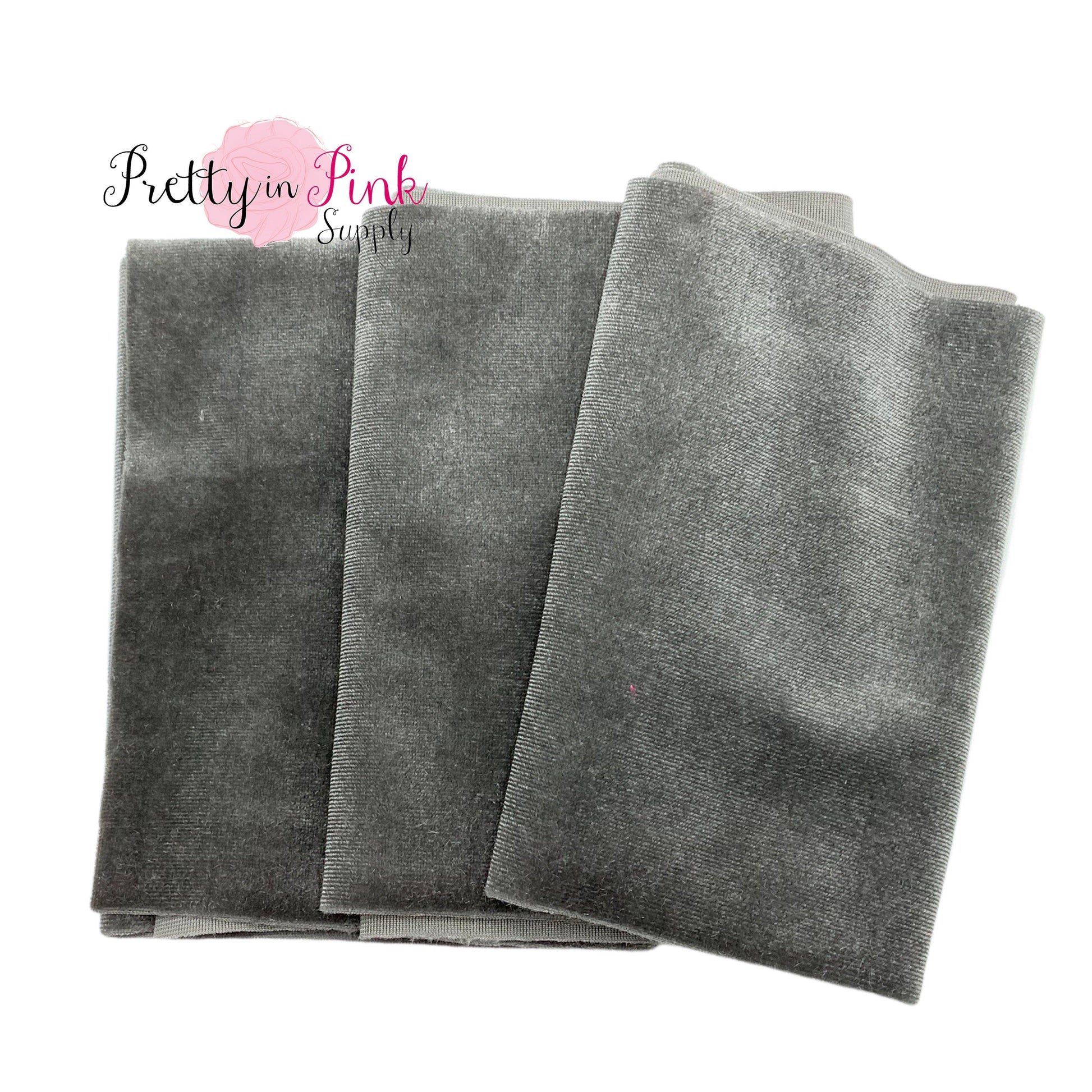Folded grey velvet fabric strip.