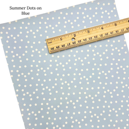 Summer dots on pale blue faux leather sheet.