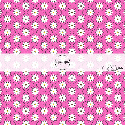 Hot pink fabric by the yard with white daisies and thin black wavy lines.