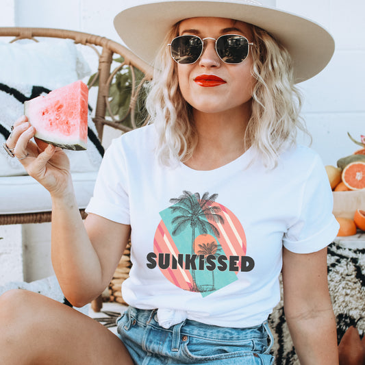 Iron on heat transfer with palm trees and the sun, as well as the phrase "Sunkissed"