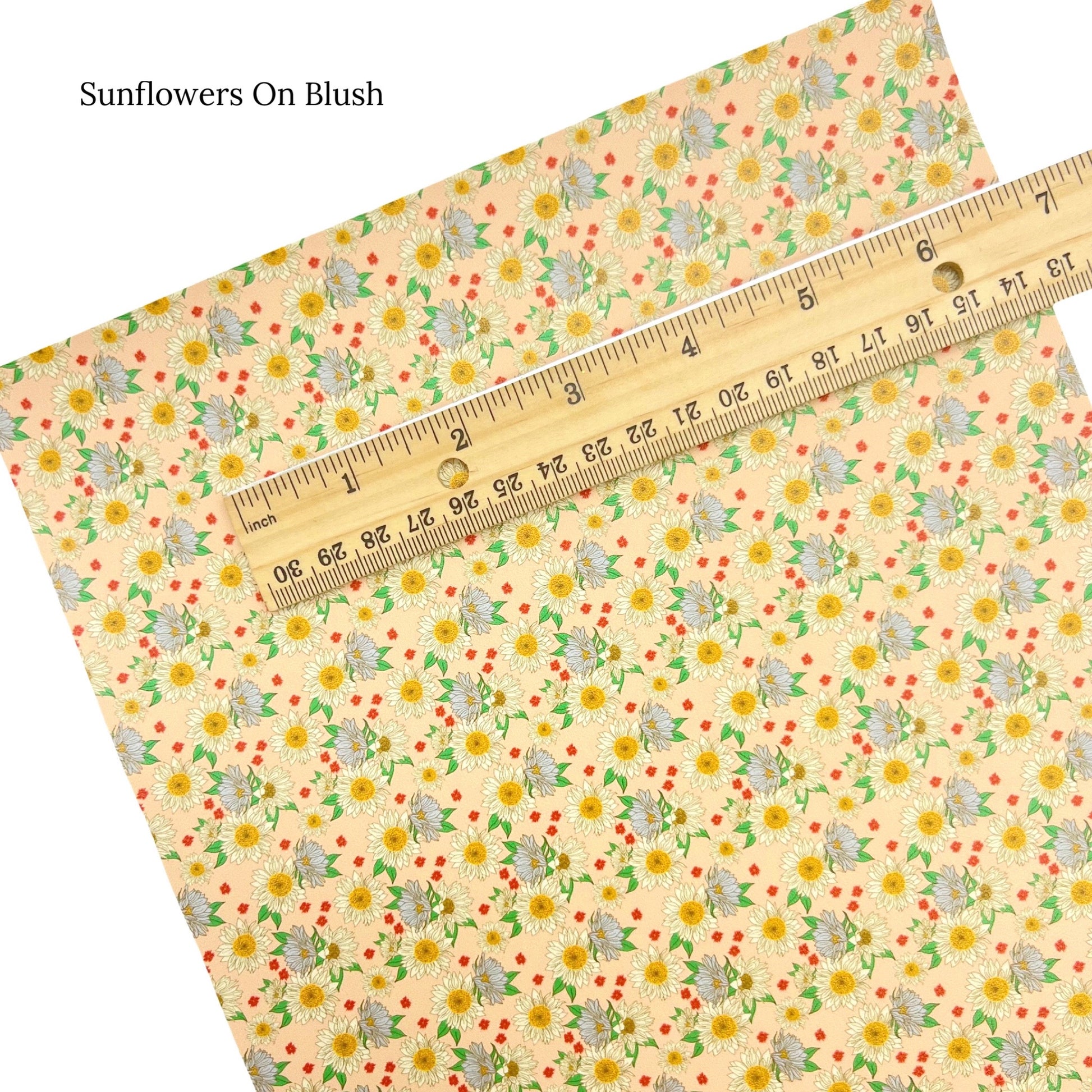 Sunflowers on blush faux leather sheet.