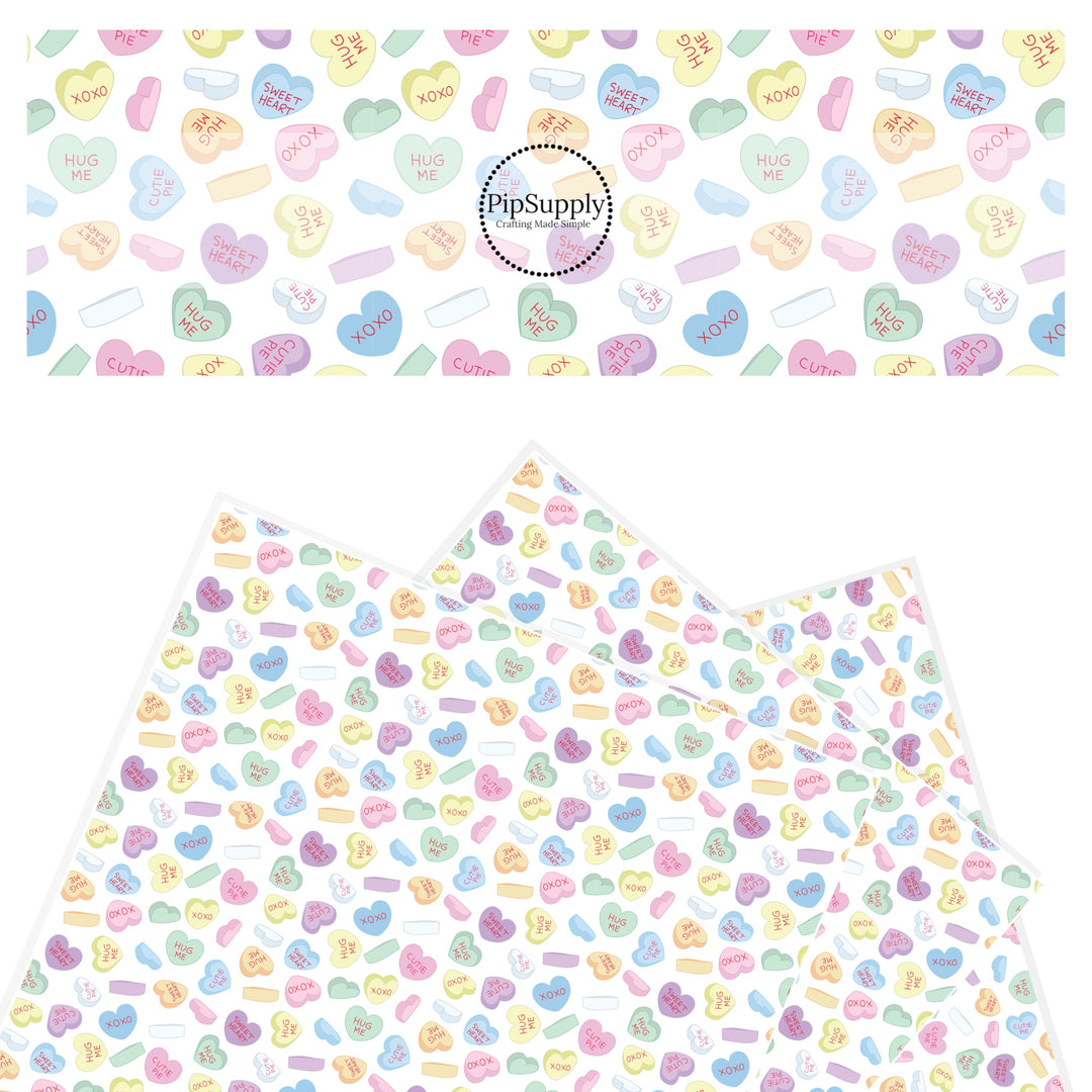 Pastel candy hearts on white faux leather sheets