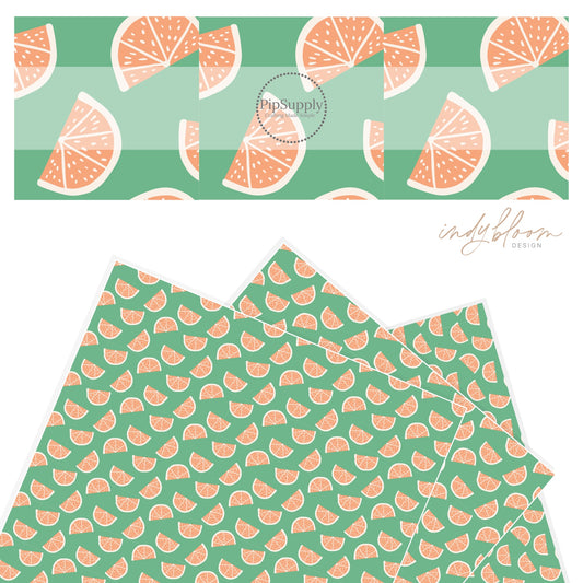 Sliced tangerines in summer green faux leather sheet.