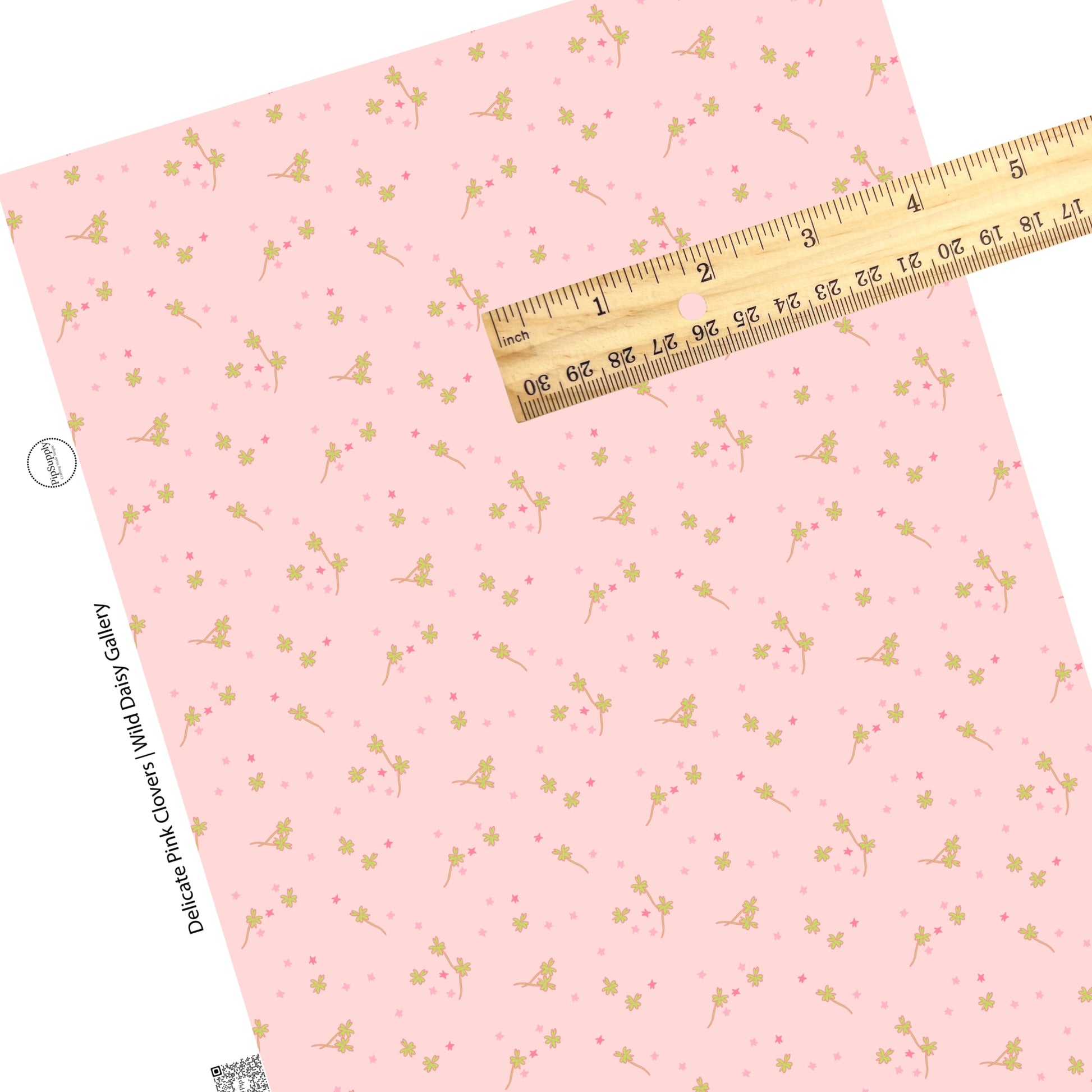 Pink stars with green clover flowers on a pink faux leather sheet